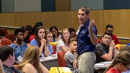 Professor teaching in a classroom.