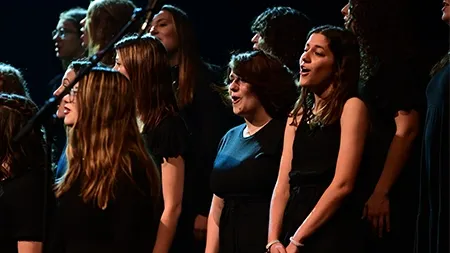 Small group from Women's Choir performing onstage